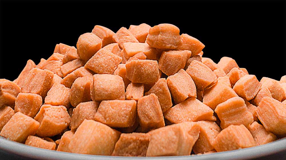 Golden brown Mikey’s Gourmet Chin-Chin piled in a bowl, showing the crisp pieces.